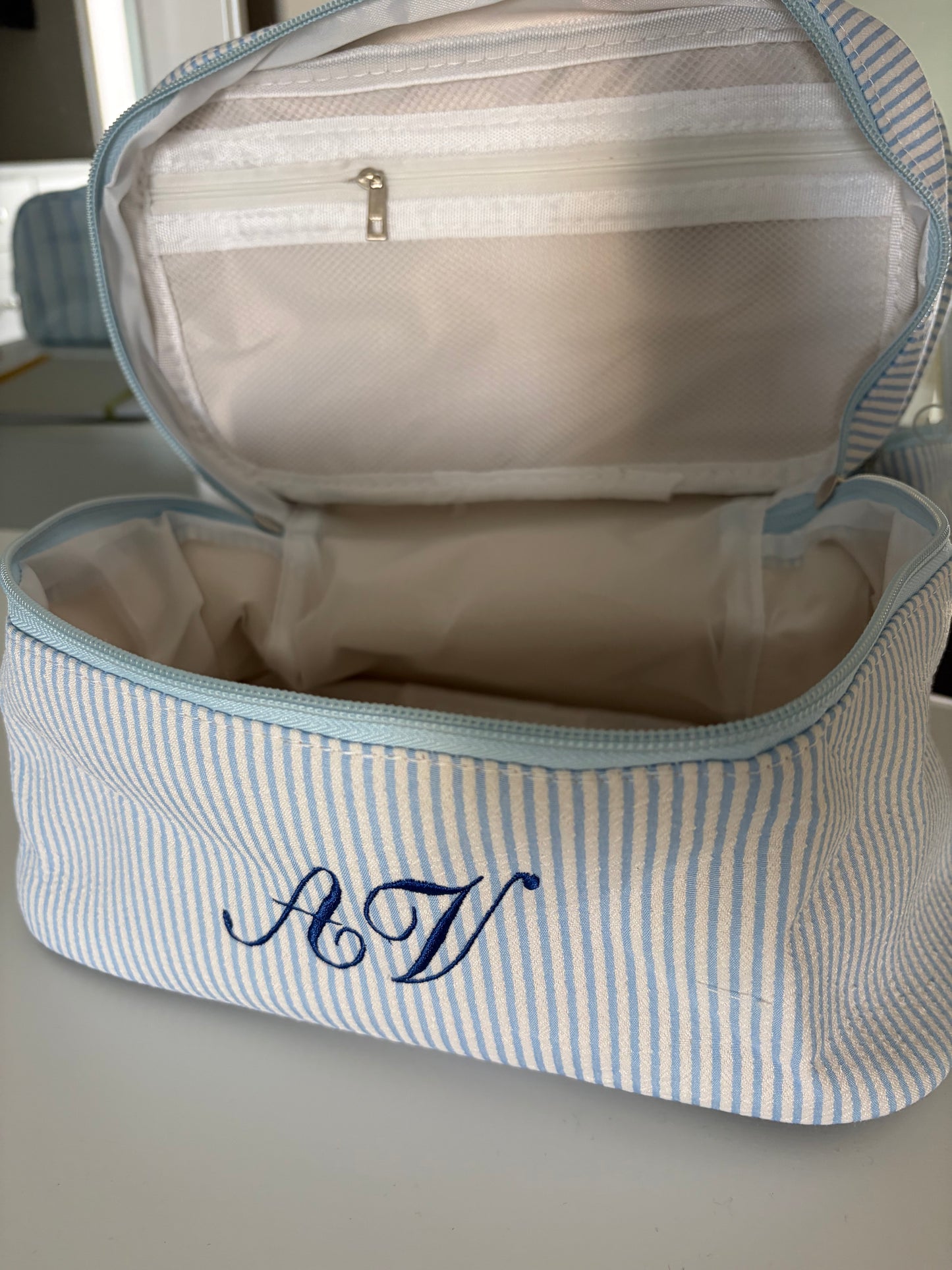 Striped embroidered makeup bag