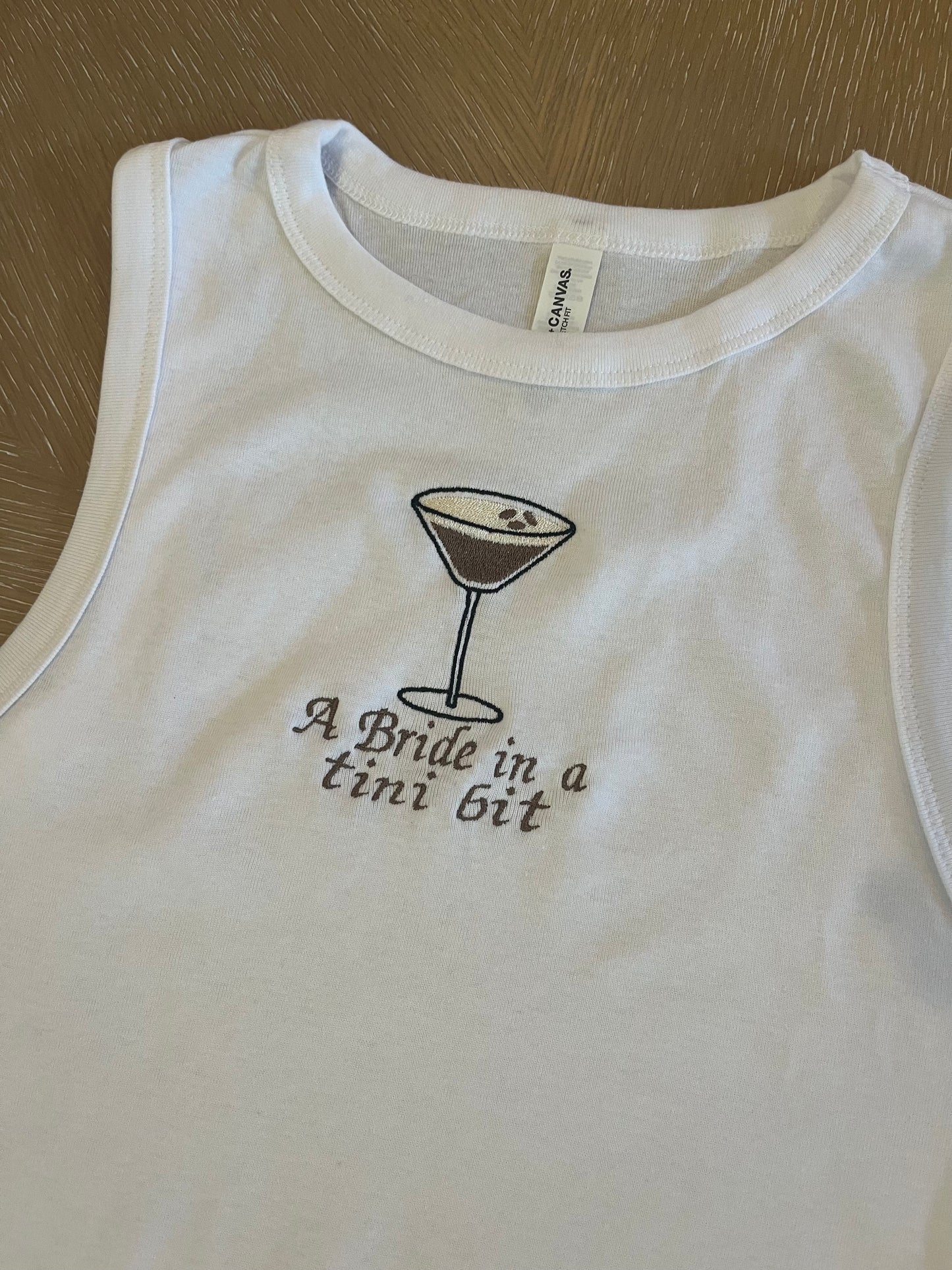 A bride in a tini bit embroidered espresso tank