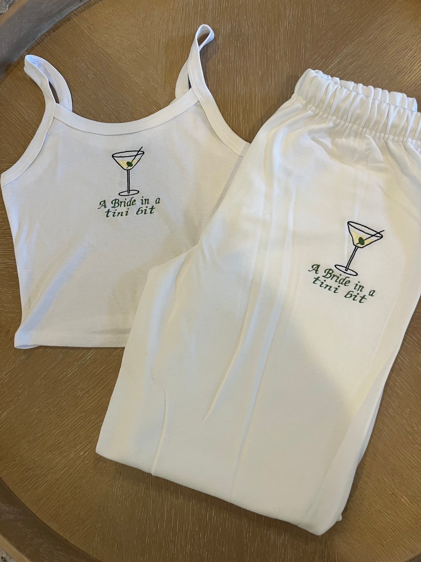 A bride in a tini bit embroidered set