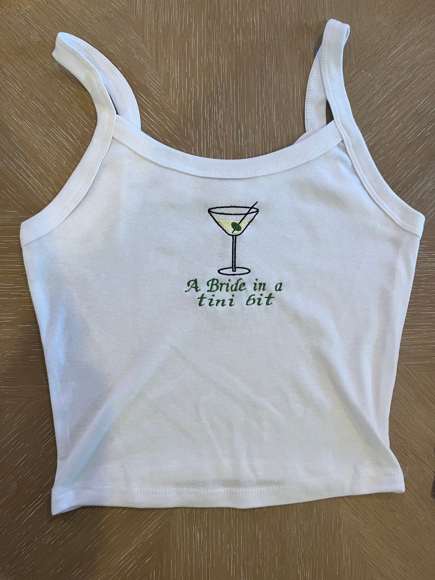 A bride in a tini bit embroidered tank
