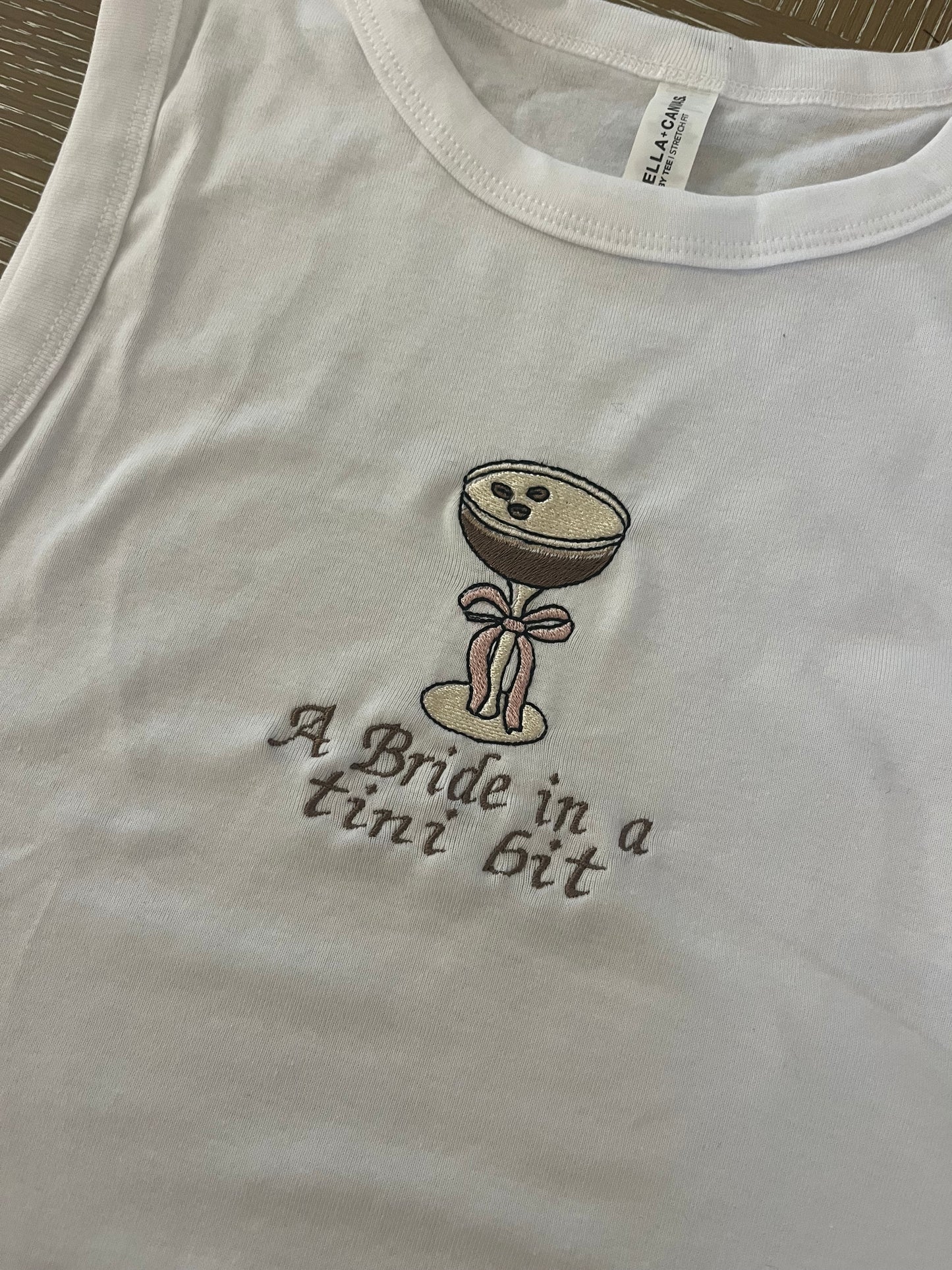 A bride in a tini bit embroidered tank