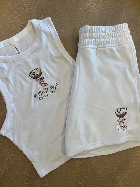 A bride in a tini bit embroidered espresso bow shorts set