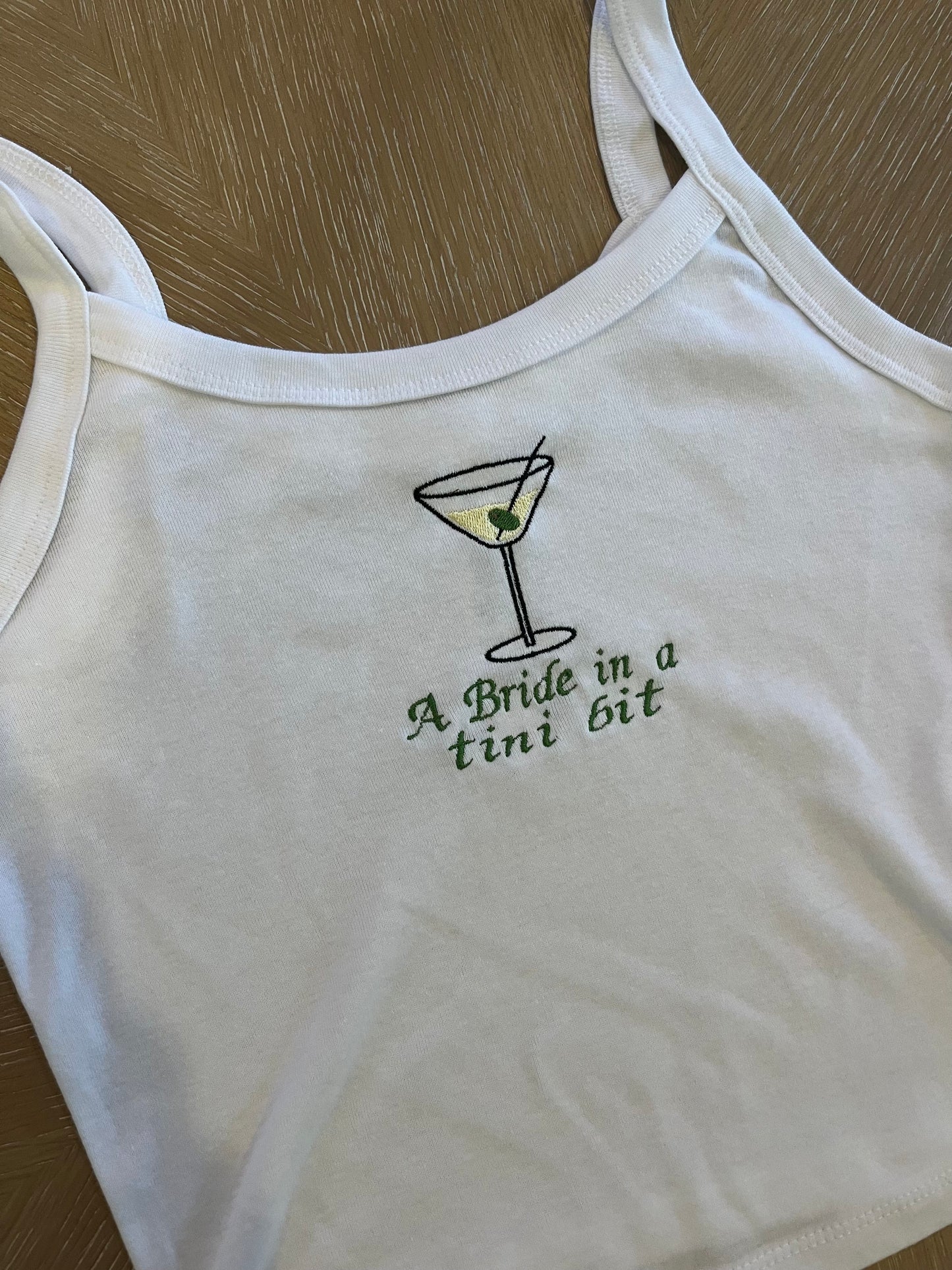 A bride in a tini bit embroidered tank