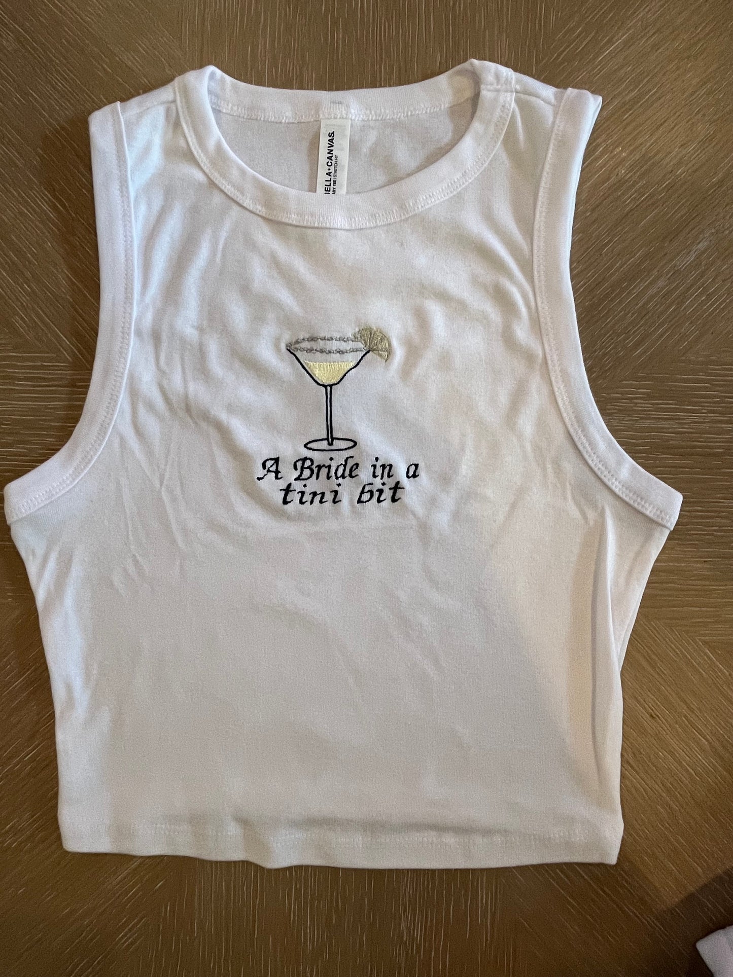 A bride in a tini bit embroidered lemon drop tank