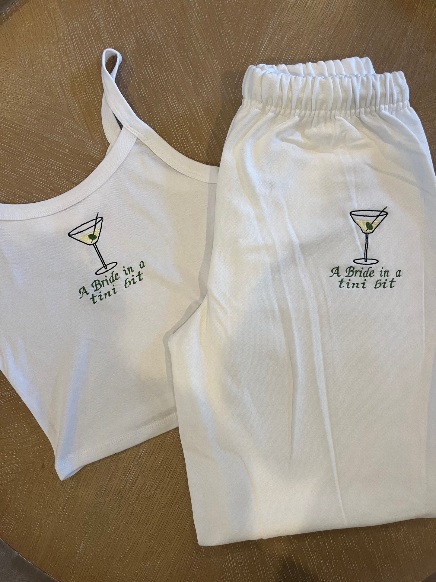 A bride in a tini bit embroidered set
