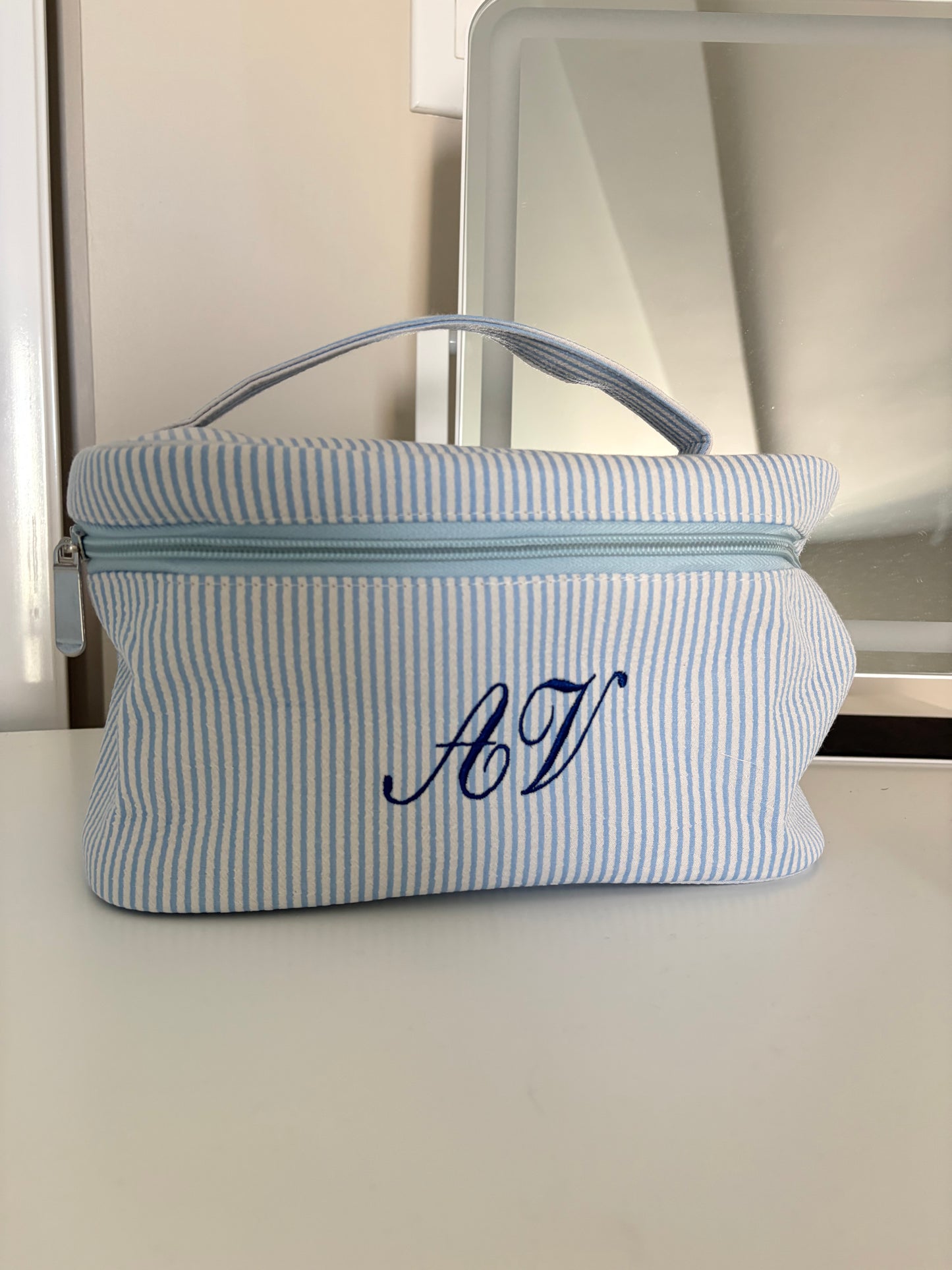 Striped embroidered makeup bag