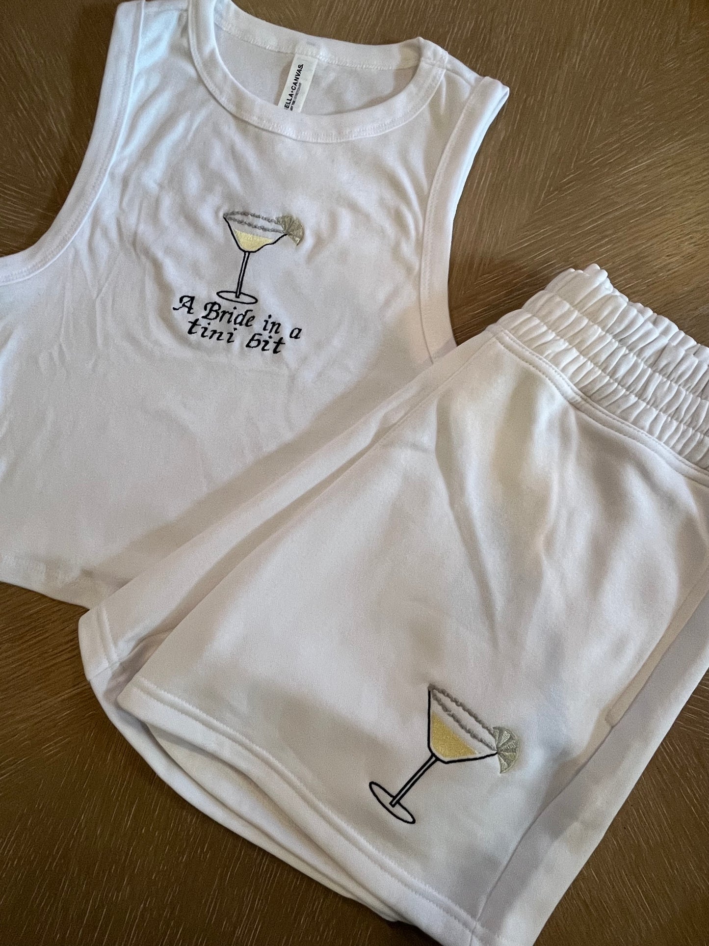 A bride in a tini bit embroidered lemon drop set