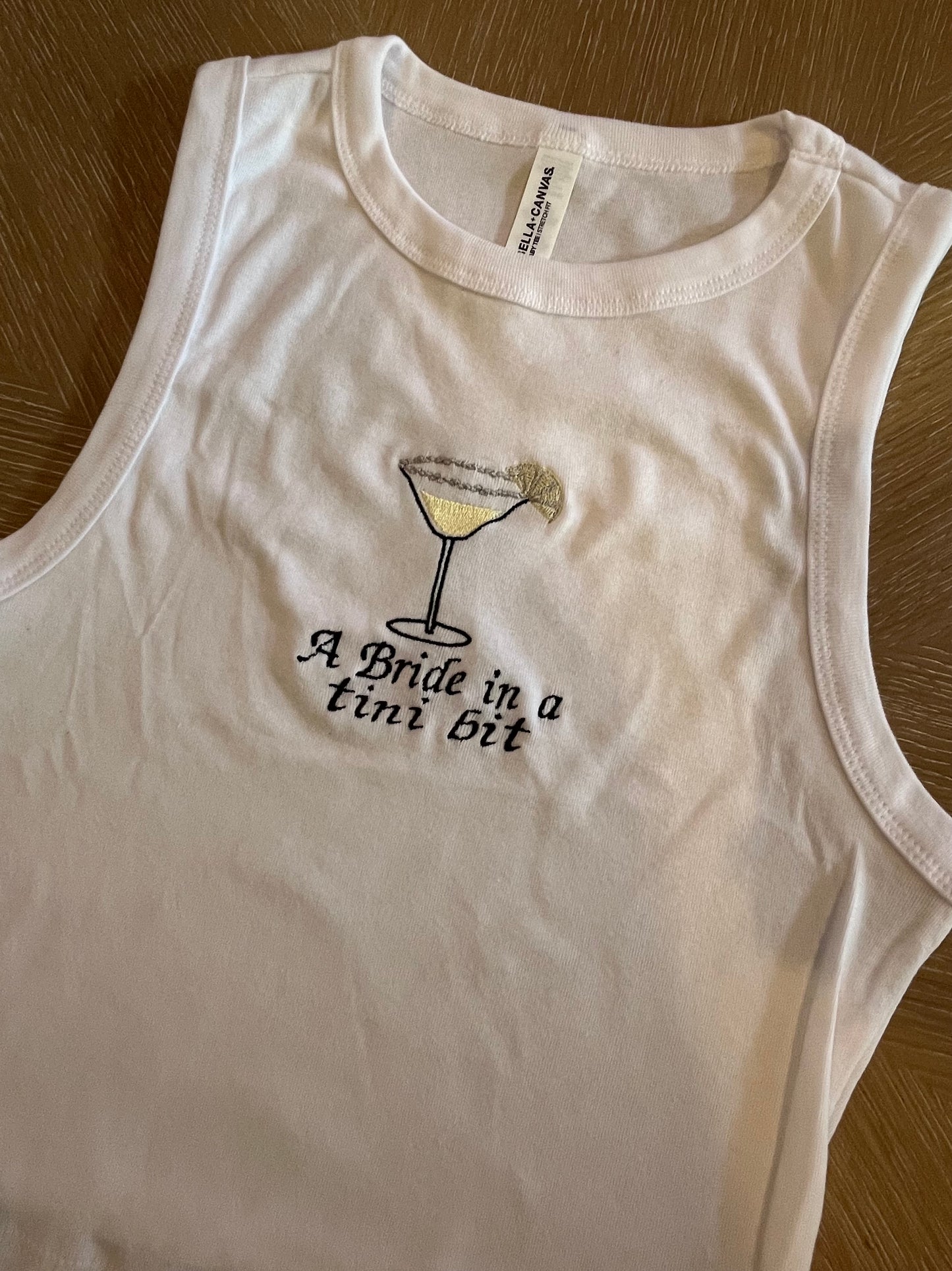A bride in a tini bit embroidered lemon drop tank