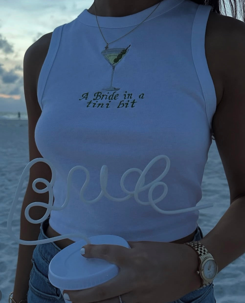 A bride in a tini bit embroidered tank top